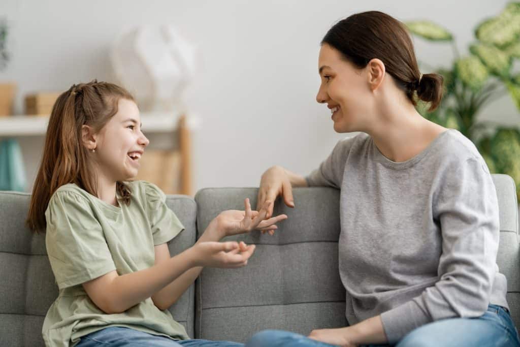 mother and daughter laughing