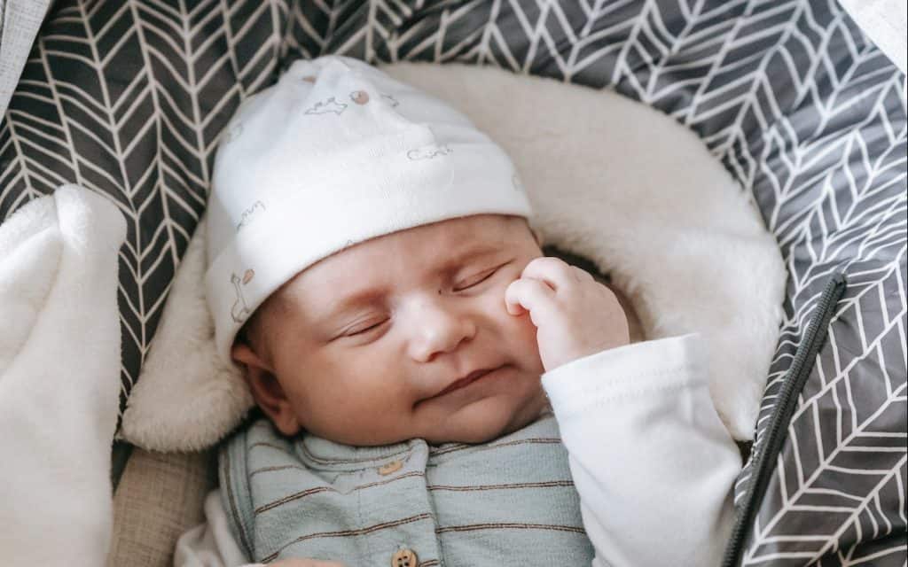 sleeping baby on bassinet