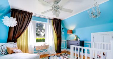 baby's room with ceiling fan