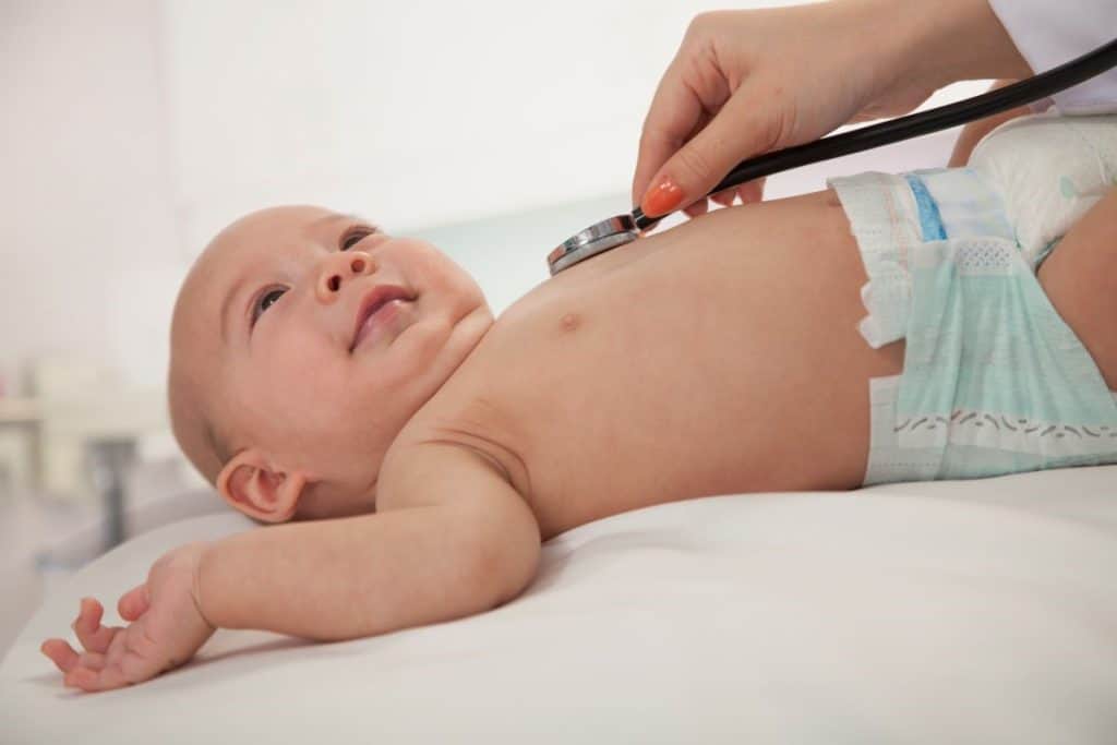 doctor checking baby's heart rate