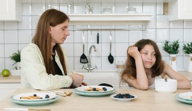girl ignoring his father