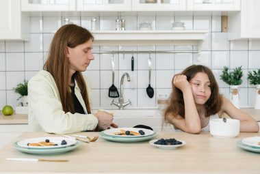 girl ignoring his father
