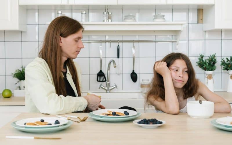 girl ignoring his father