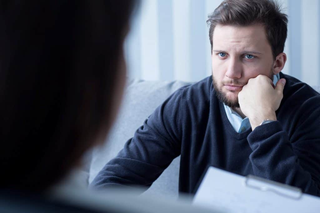 man talking to a therapist