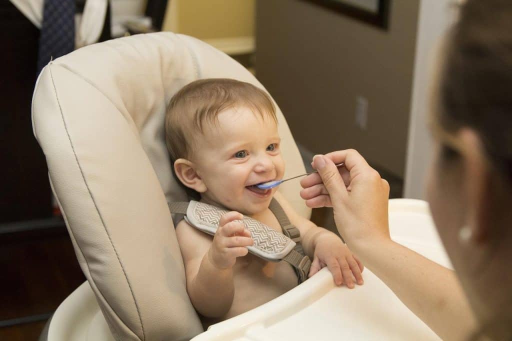 mom feeding baby