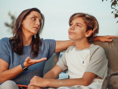 mother and son having a conversation