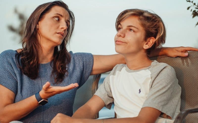 mother and son having a conversation
