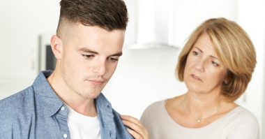 worried mom trying to talk to son