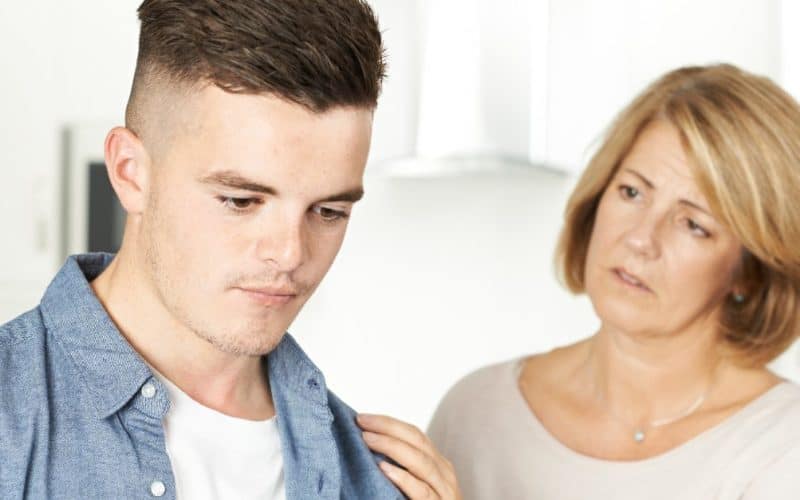 worried mom trying to talk to son