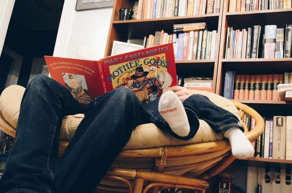 father and son reading a book