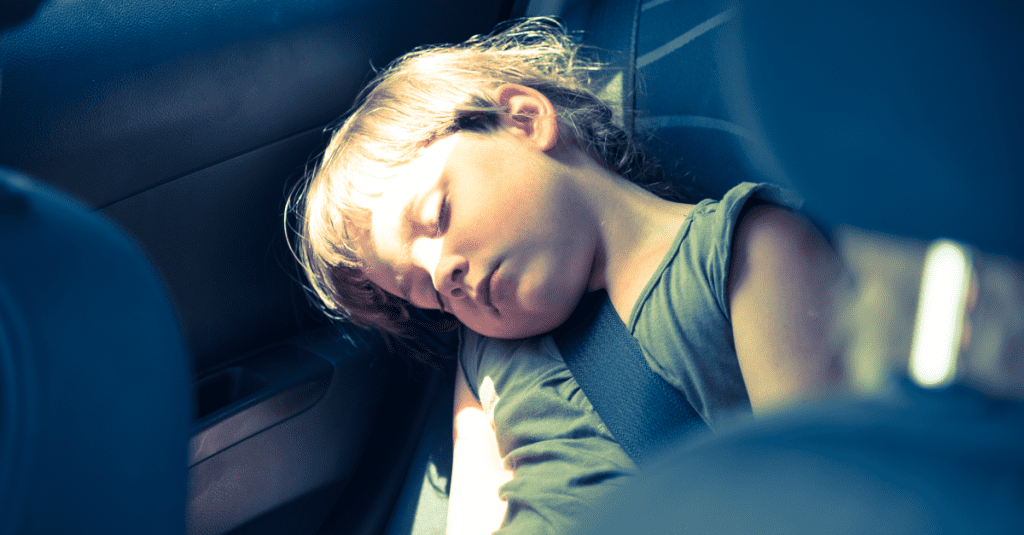 girl sleeping on the backseat
