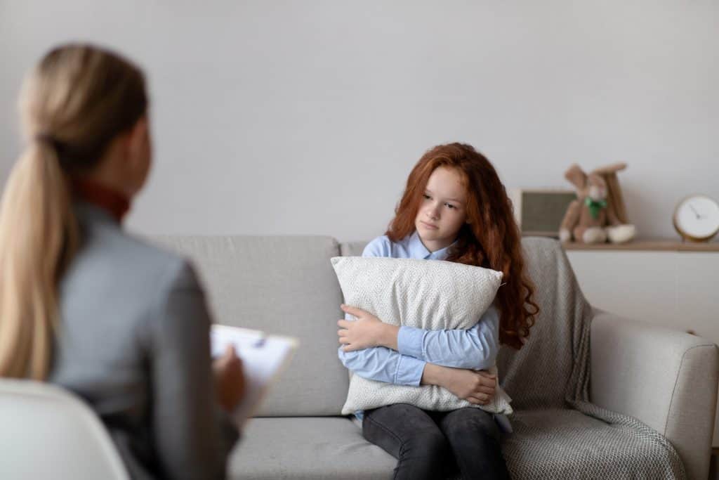 girl talking to a therapist
