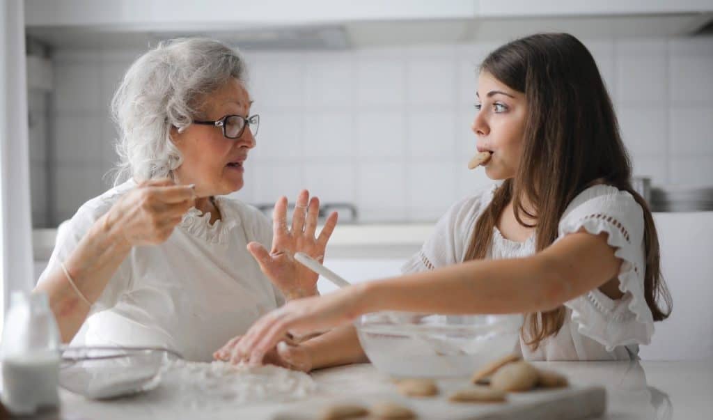 grandma talking to her grand daughter