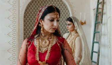 Indian mother standing beside her daughter