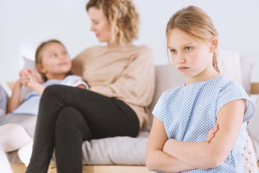 jealous child mom favors another sibling