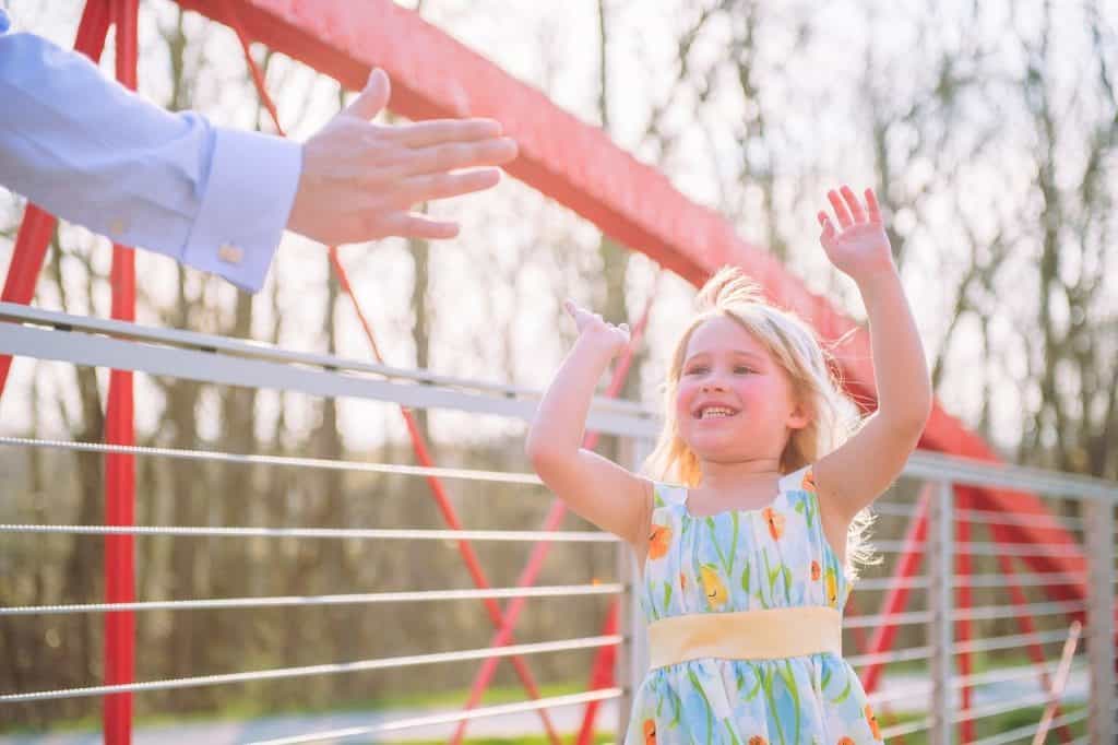 little girl highfiving dad