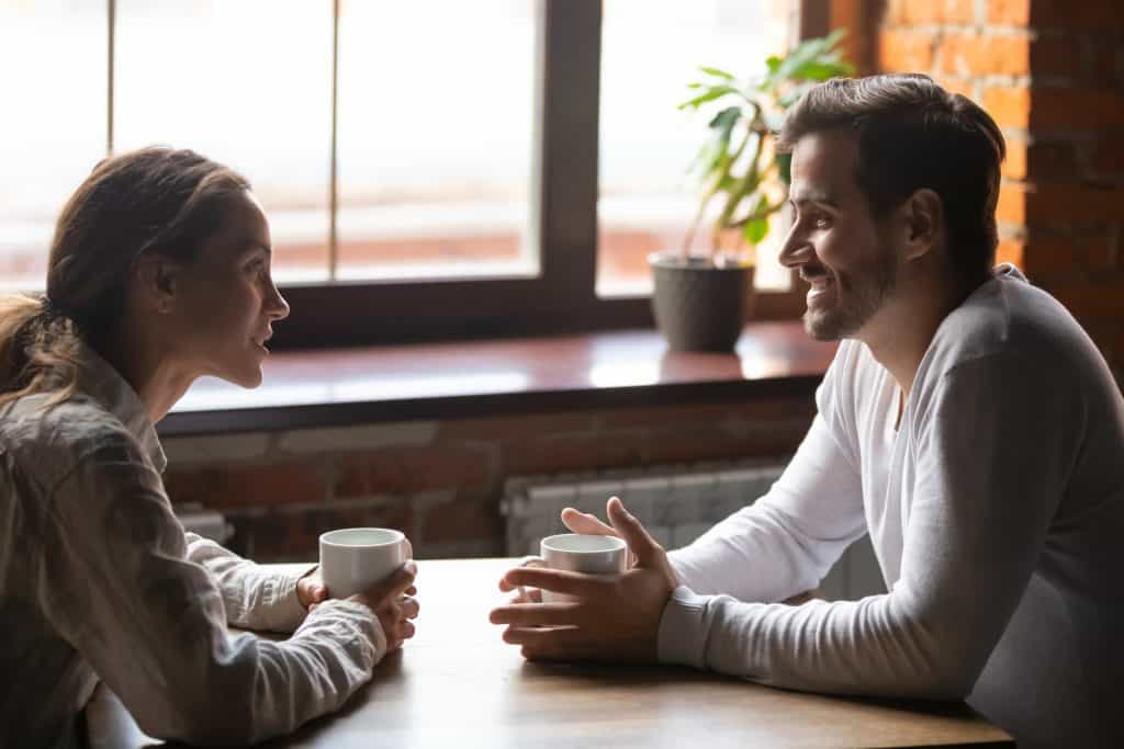 man and woman having coffee