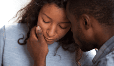 man consoling his wife