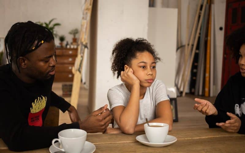 parents speaking to daughter
