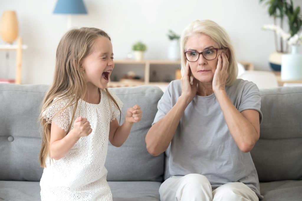 screaming child in front of her grandma