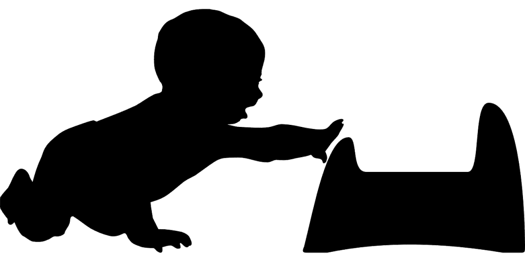 silhoutte of a baby reaching for potty