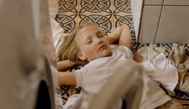 sleepy girl on a laundry room