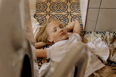 sleepy girl on a laundry room