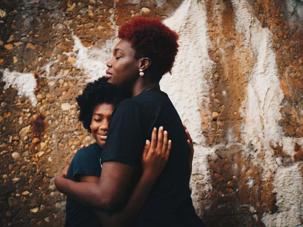 two woman hugging