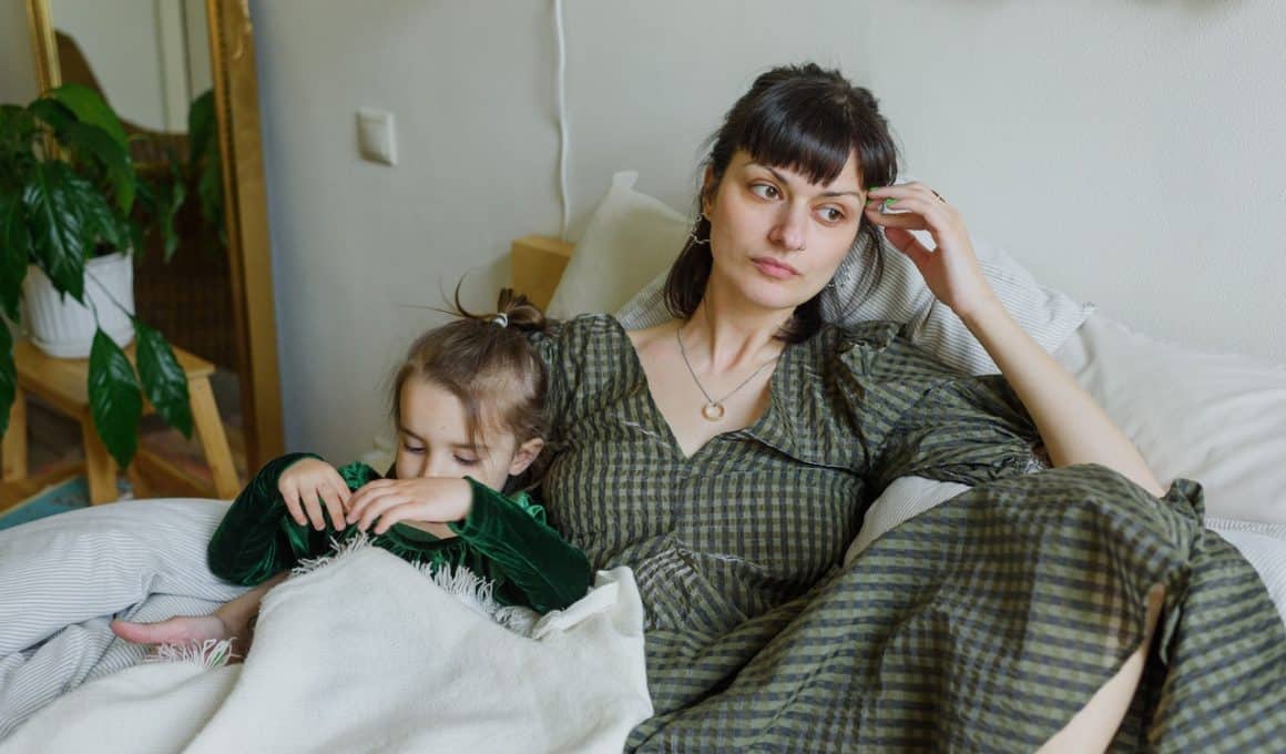 woman on bed with daughter questioning her life choices