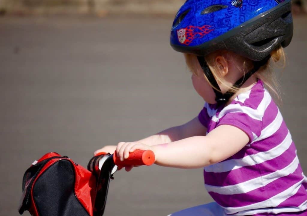 baby girl riding a bike