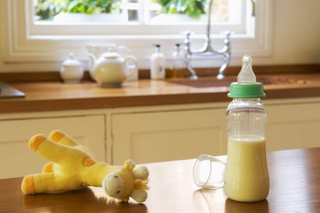 baby's milk with giraffe toy