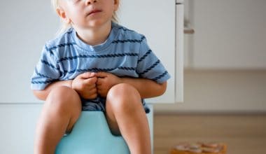 boy sitting on a potty