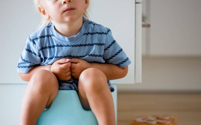 boy sitting on a potty