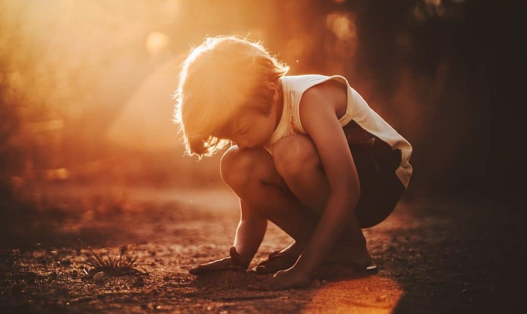 child playing with sand