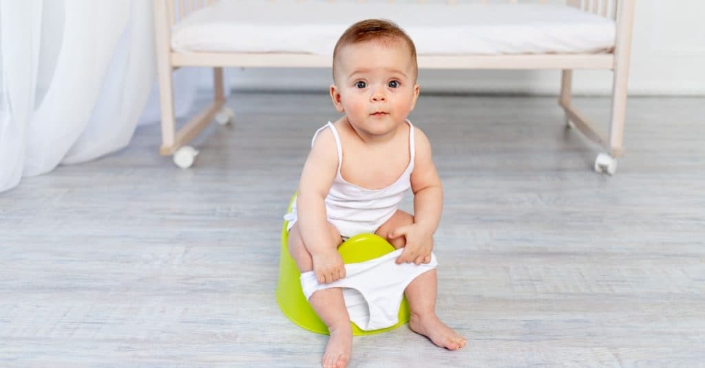 cute baby girl on a potty