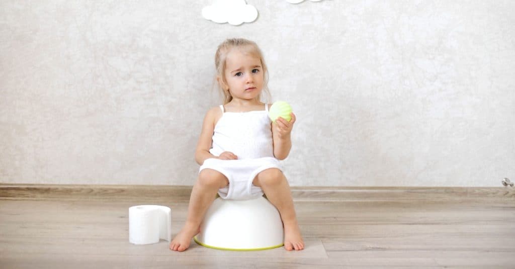 girl sitting on potty