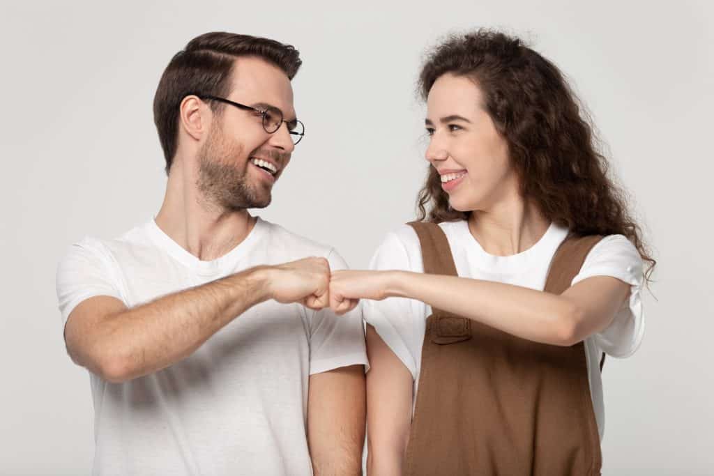 man and woman fisting each other
