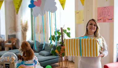mom holding baby shower gift