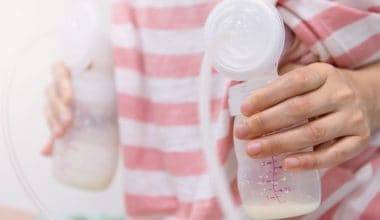 mom using breast pump
