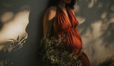 pregnant woman standing on a wall