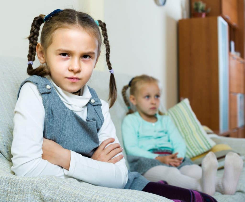 sisters sitting on a couch