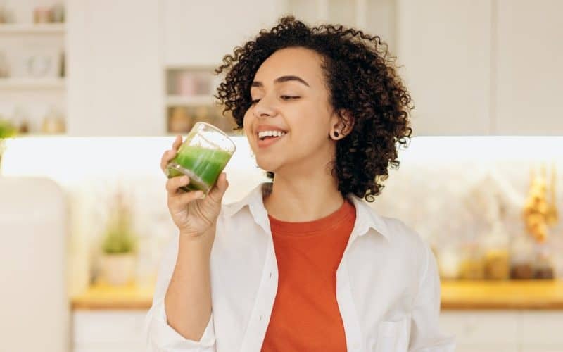 woman drinking smoothie