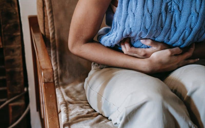 woman suffering from stomach pain