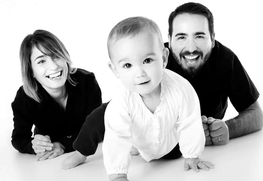 baby crawling with mom and dad