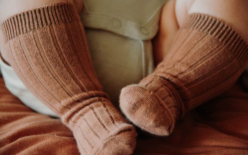 baby with brown socks