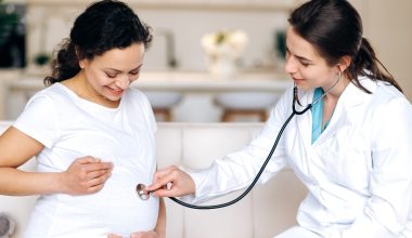 doctor checking baby heartbeat