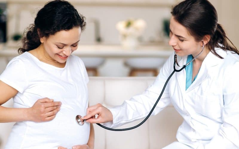 doctor checking baby heartbeat