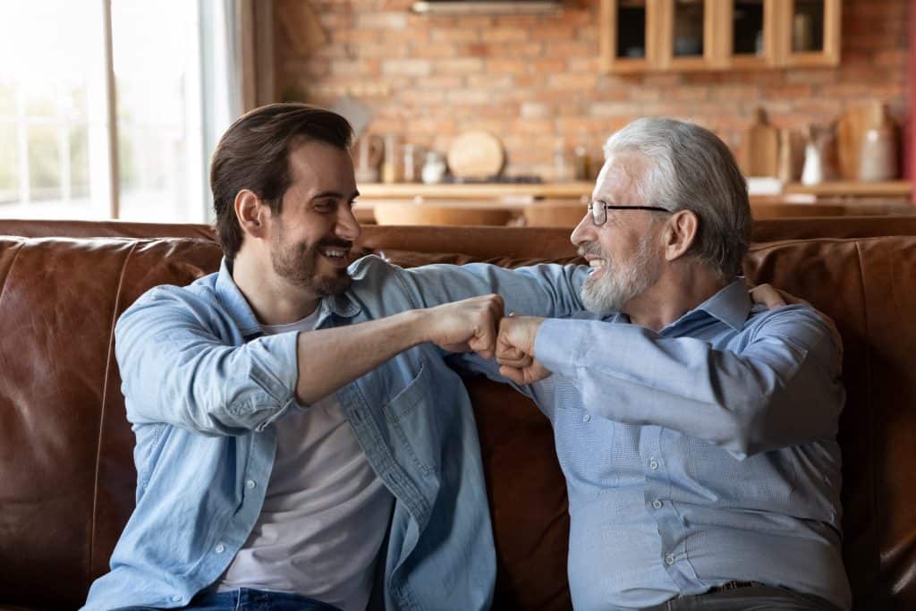 father and son fisting each other