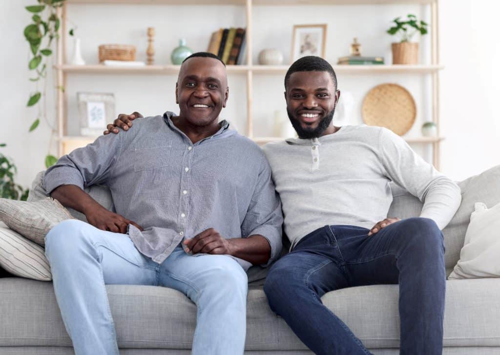 father and son on a couch