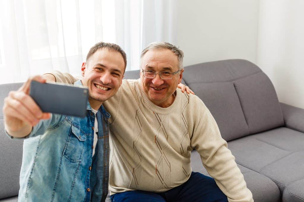 father and son taking a selfie